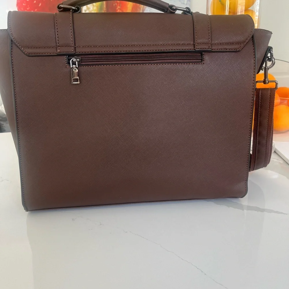 Brown Leather Briefcase with Adjustable Straps and Top Handle